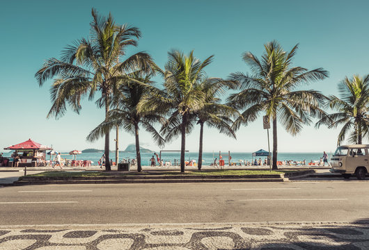 People enjoying the sun on famous Ipanema Beach in Rio de Janeiro