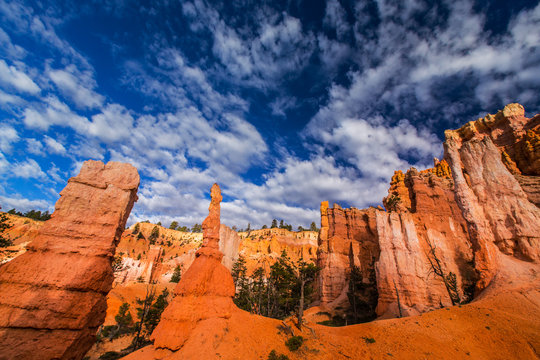 Bryce Canyon scenery, profiled on deep blue sky with clouds