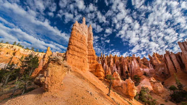 Bryce Canyon scenery, profiled on deep blue sky with clouds