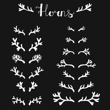 Set of hand drawn deer horns white on the black background, silhouette of antlers