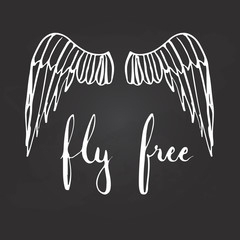 Hand drawn typography lettering phrase Fly free with birds wings on the black background.