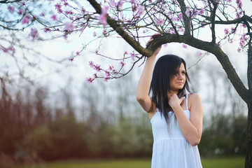 Young adult woman portrait tree blossom