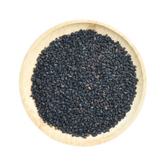 Black sesame in wooden bowl isolated on white background