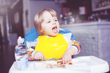 The child is eating in a restaurant.