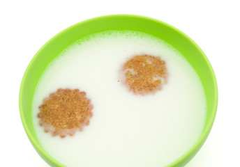 crackers floating on bowl of milk with copy space