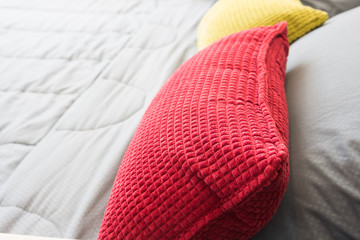 close up red pillow on the bedroom