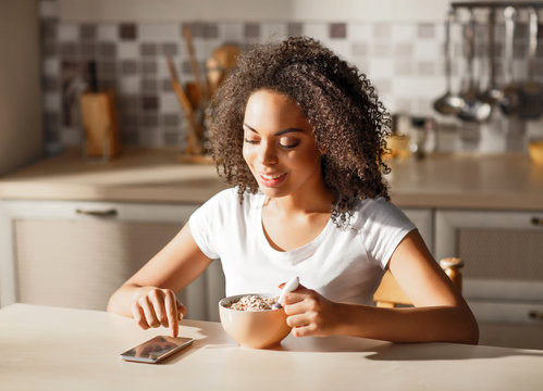 Nice Girl Sitting In The Kitchen