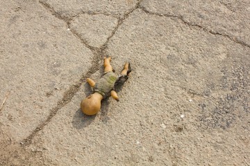 Burned old kewpie doll