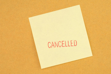 Stamp cancelled on yellow post it note.