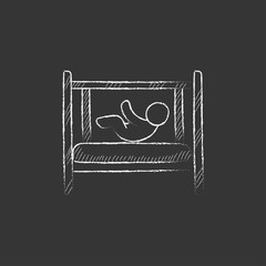 Baby laying in crib. Drawn in chalk icon.