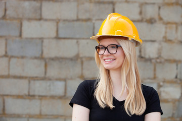 Young architect with yellow helmet