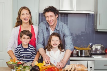 Portrait of happy family in kitchen