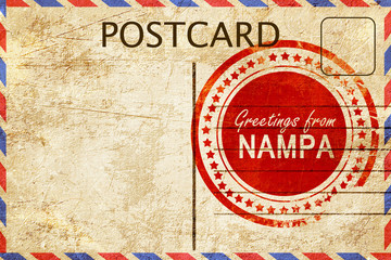 Naklejka premium nampa stamp on a vintage, old postcard