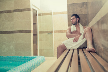 Black beard undressed man relaxing at spa