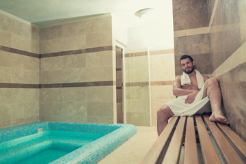 Black beard undressed man relaxing at spa