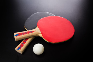 tabletennis racket and ball on table