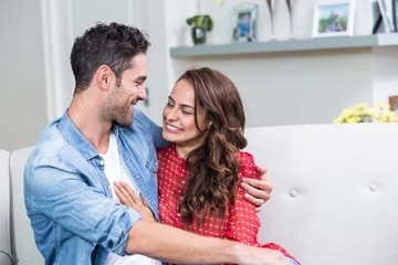 Smiling couple embracing 