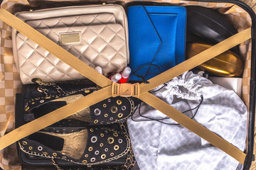 Packed suitcase of vacation items