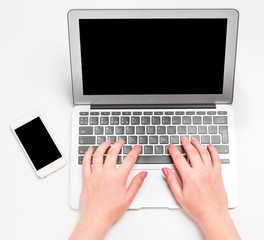 Female hands typing on the laptop keyboard
