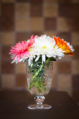 Bright colored flowers in a vase