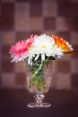 Bright colored flowers in a vase