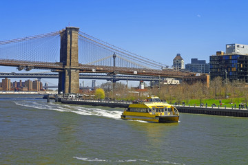 Ferry at Brooklyn bridge and Manhattan bridge over East River