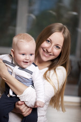 Mother and her little son at home