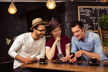 Friends using smartphones