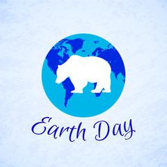 Silhouette of a bear over planet Earth. Earth Day