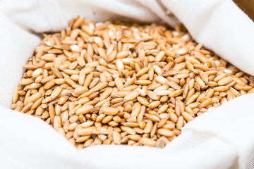 Uncooked  brown  rice texture in white bag