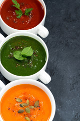 assortment of fresh vegetable soup on a black background