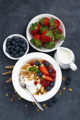 baked muesli with fresh berries and yogurt for breakfast