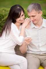 Couple engrossed with phone