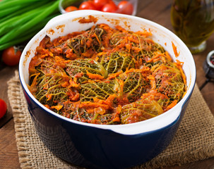 Stuffed savoy cabbage rolls in tomato sauce
