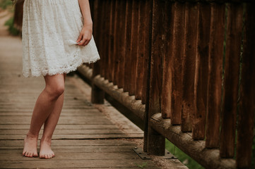 Close-up of a bare legs of a girl in the woods