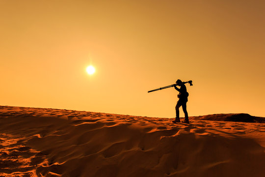 A man walking on sand desert