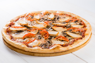 tasty pizza on a white wooden background
