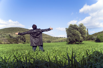 Fototapeta premium Healthy and happy young man greets the nature