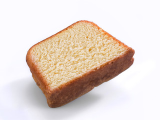 Portion of a pound cake on white background
