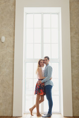 Fototapeta na wymiar man and woman near a large window.