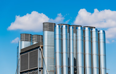 shiny chrome pipes against the blue sky