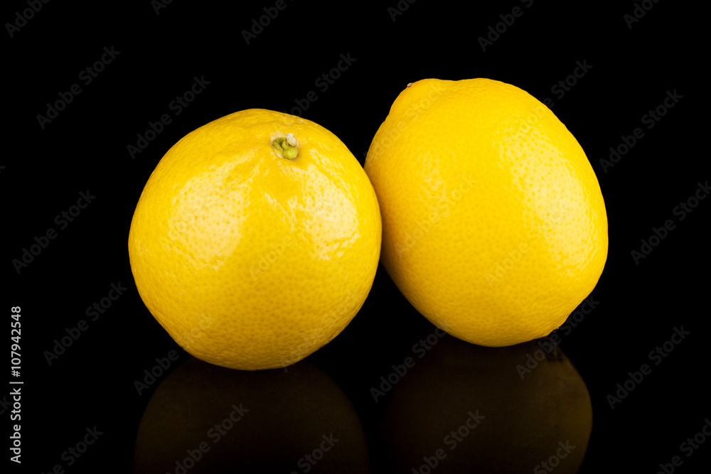 Wall mural lemons group isolated on black background