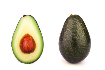 Whole and half avocado isolated on white background