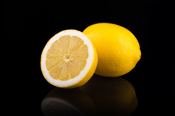 Ripe lemons. Isolated on black background - 107942519