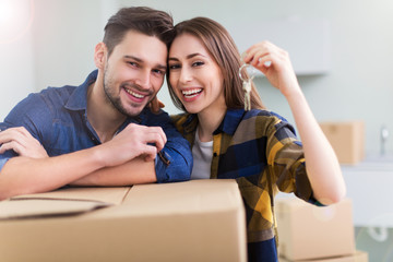 Couple with keys to new home