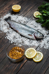 fresh fish ready to be cook on a wooden table