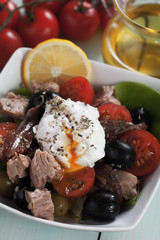 Salad nicoise with poached egg