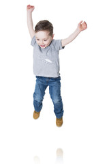 Little boy jumping in the air