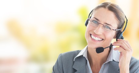 Composite image of portrait of a call center executive wearing h