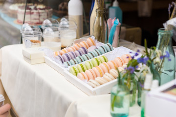 Obraz na płótnie Canvas Flavored colorful French macarons on a sale